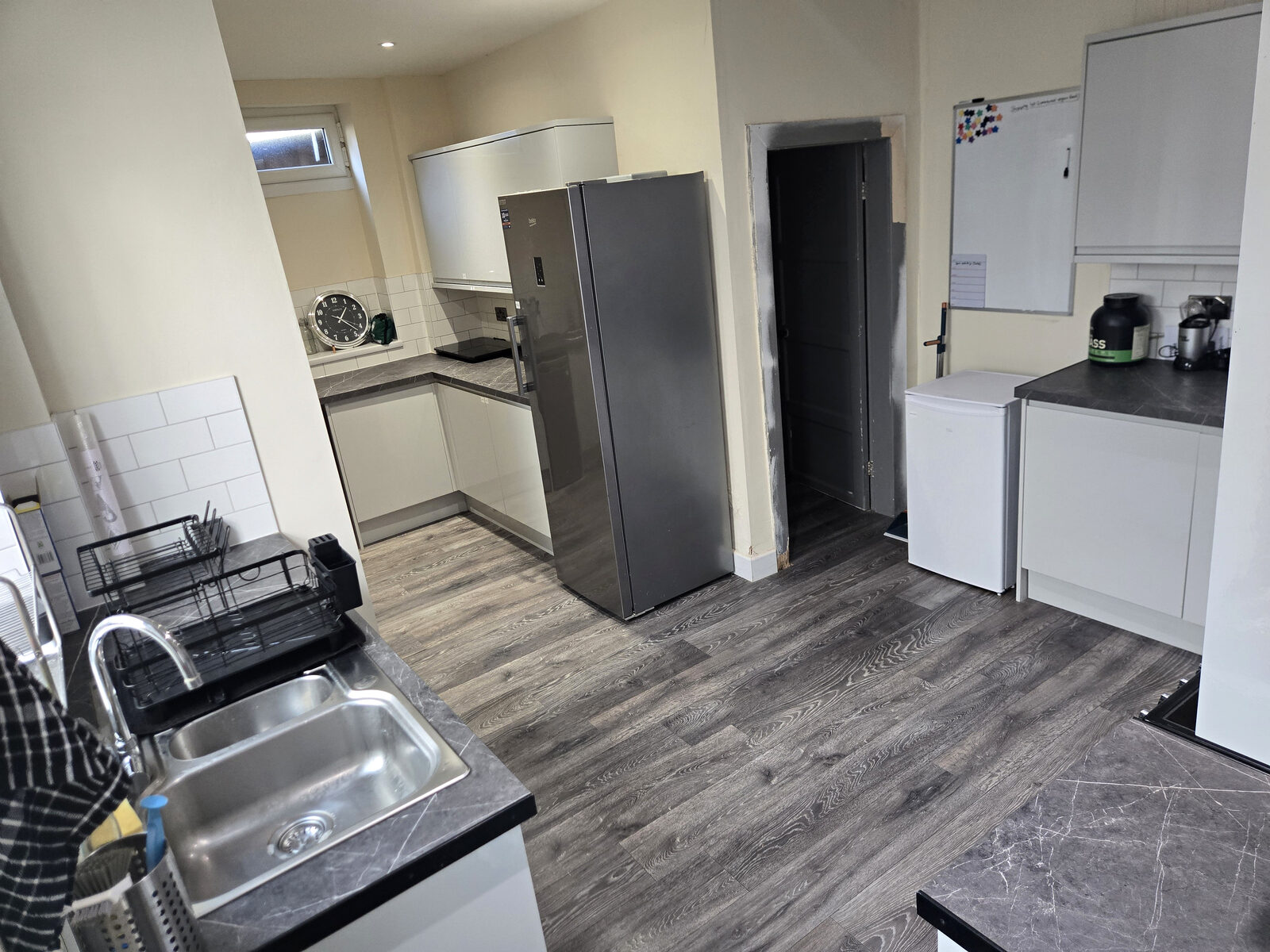 The shared kitchen, with fridge freezer and worktops